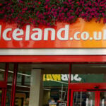 Iceland Store front .co.uk with flowers hanging 